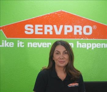 A professional female employee in SERVPRO attire