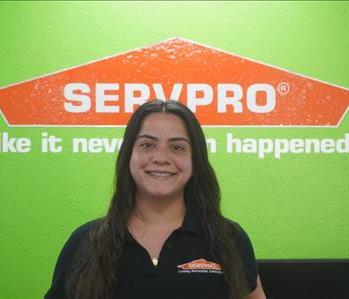 A professional female employee in SERVPRO attire
